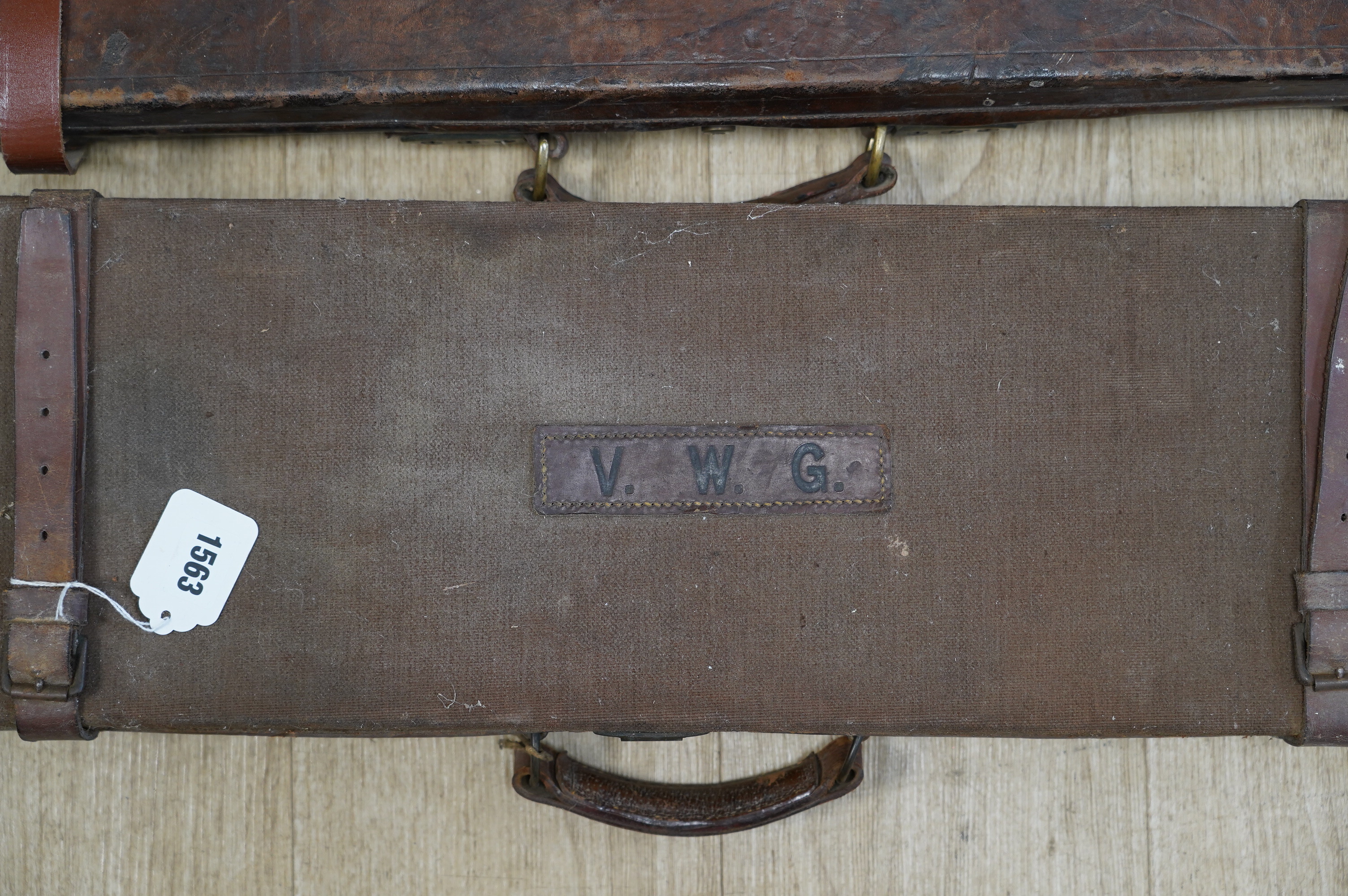 Two leather gun cases, largest 85cm wide, 34cm deep. Condition - fair considering age and use